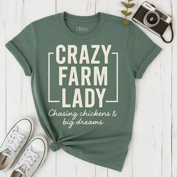 Sage green tee reading Crazy Farm Lady, Chasing chickens and big dreams, a Farm Nine shirt concept