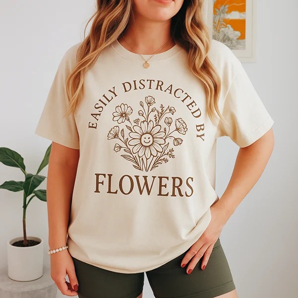 Cream tee with an Easily Distracted By Flowers line-art graphic, a Farm Nine shirt concept by Pressed Local