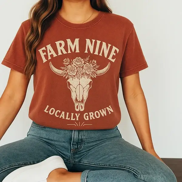 Rust tee with a floral steer skull and Farm Nine Locally Grown lettering, a shirt concept by Pressed Local