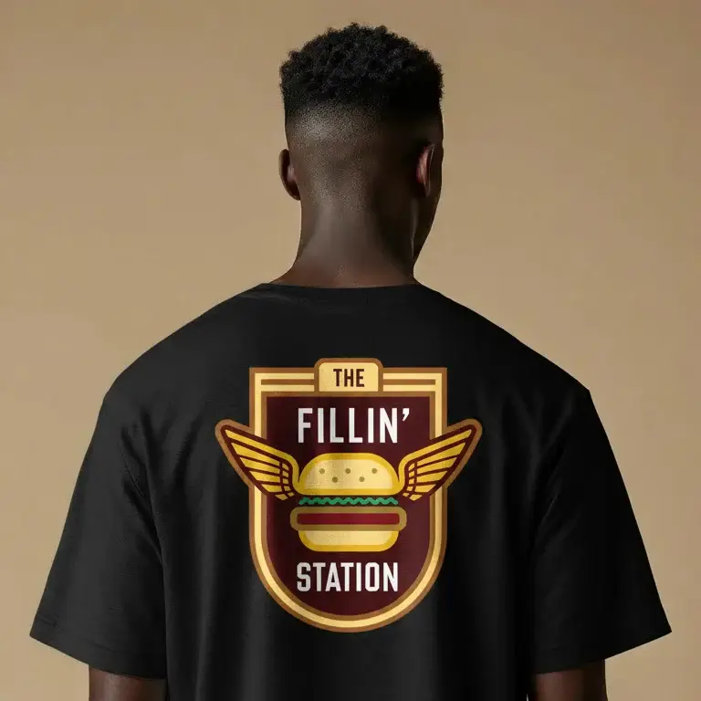 Back of a black tee with The Fillin Station winged burger crest, a shirt concept by Pressed Local